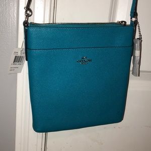 turquoise/blue Coach cross body purse